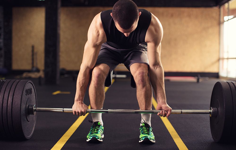Mastering Deadlift Grip – Choosing the Best Bar Hold & Understanding Strap Rules in Competition